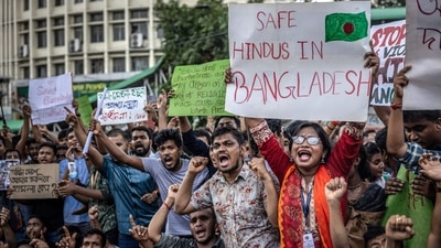 Hindus in Bangladesh form 8 per cent of the total population, with 170 million people. 45 Hindus have been injured due to attacks and one school teacher has passed away. The Bangladesh Hindu Buddhist Christian Unity Council estimates at least 52 of the country's 64 districts have been impacted by communal violence since August 5. (AFP) Hindus in Bangladesh form 8 per cent of the total population, with 170 million people. 45 Hindus have been injured due to attacks and one school teacher has passed away. The Bangladesh Hindu Buddhist Christian Unity Council estimates at least 52 of the country's 64 districts have been impacted by communal violence since August 5. (AFP)