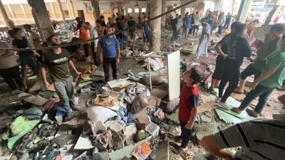 In this image made from a video, people inspect the dome at a school after being hit by an Israeli airstrike in Gaza City Saturday, Aug. 10, 2024. (AP) In this image made from a video, people inspect the dome at a school after being hit by an Israeli airstrike in Gaza City Saturday, Aug. 10, 2024. (AP)