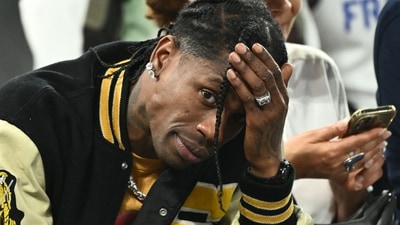 US rap artist Travis Scott gestures as he attends the men's semi-final basketball match between France and Germany during the Paris 2024 Olympic Games at The Bercy Arena in Paris on August 8, 2024. Paris prosecutor's office announced on August 9, 2024, that US rap artist Travis Scott has been arrested in Paris after a fight at The Georges V Hotel in the French capital. (AFP / Aris MESSINIS) US rap artist Travis Scott gestures as he attends the men's semi-final basketball match between France and Germany during the Paris 2024 Olympic Games at The Bercy Arena in Paris on August 8, 2024. Paris prosecutor's office announced on August 9, 2024, that US rap artist Travis Scott has been arrested in Paris after a fight at The Georges V Hotel in the French capital. (AFP / Aris MESSINIS)