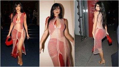 This show-stopping look is from the 2022 Paris Fashion Week. She wore a daring white lace gown with a thigh-high slit, underlying red satin fabric and mesh cuts on the stomach and thighs. (Instagram) This show-stopping look is from the 2022 Paris Fashion Week. She wore a daring white lace gown with a thigh-high slit, underlying red satin fabric and mesh cuts on the stomach and thighs. (Instagram)