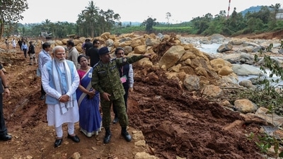 During his on-the-ground assessment of the affected areas, the Prime Minister was briefed by Kerala’s ADGP (law and order), MR Ajith Kumar. (GoI) During his on-the-ground assessment of the affected areas, the Prime Minister was briefed by Kerala’s ADGP (law and order), MR Ajith Kumar. (GoI)