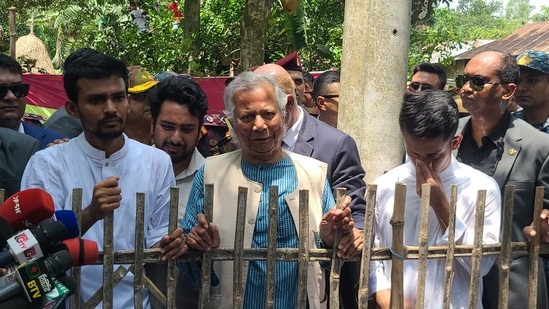 Nobel laureate and chief adviser of Bangladesh's new interim government, Muhammad Yunus (C), visits slain Abu Sayeed's house, who was killed by police during the anti-quota protests, in Rangpur on August 10, 2024. (Photo by AFP)