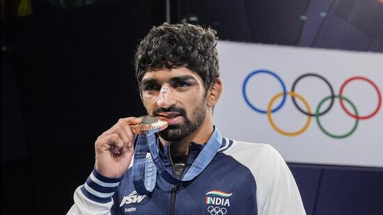 Bronze medallist Aman Sehrawat at the podium during the medal ceremony for the men's 57kg freestyle wrestling at the Paris Olympics. (PTI)