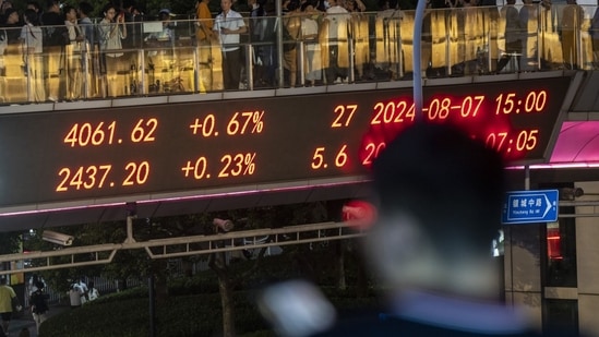 An electronic ticker displays stock figures in Shanghai, China, on Wednesday, Aug. 7, 2024. The People's Bank of China is potentially getting the respite it's been hoping for from global financial markets, bringing closer a dose of monetary stimulus long awaited by investors and traders. Photographer: Qilai Shen/Bloomberg(Bloomberg)