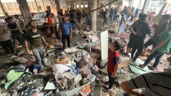 In this image made from a video, people inspect the dome at a school after being hit by an Israeli airstrike in Gaza City Saturday, Aug. 10, 2024. (AP)