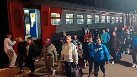 In this photo released by Russian Emergency Ministry Press Service on Friday, Aug. 9, 2024, residents from the Kursk region arrive in railway station in Tula were they were met by employees of the Russian Emergencies Ministry, volunteers, psychologists and medical workers.(AP)