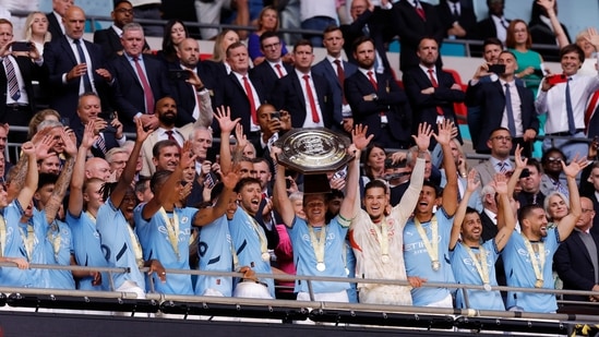 Manchester City's Kevin De Bruyne lifts the trophy as he celebrates with teammates after winning the Community Shield(Action Images via Reuters)