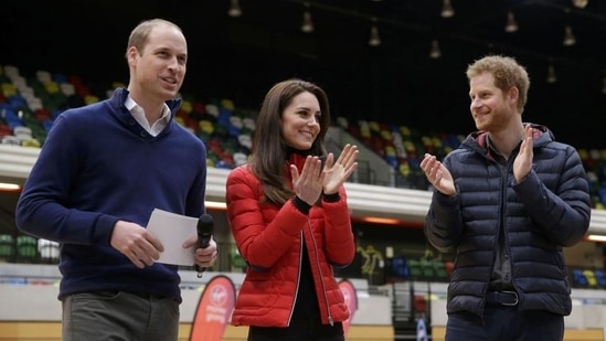 Kate, the Duchess of Cambridge, and Prince Harry (right) applaud Prince William after his speech during the promotion of the charity Heads Together at the Queen Elizabeth II Park in London. (REUTERS)