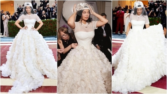 In 2022, the Met Gala theme was 'In America: An Anthology of Fashion' and Kylie married bridal and street-style trends to walk the red carpet. She wore a white strapless Off-White ballgown, mesh T-shirt, and a fishnet veil. She added another twist with a backward trucker hat.&nbsp;(Instagram)