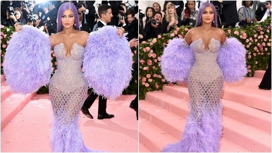 Kylie's 2019 Met Gala look is one of the most talked-about dresses she has ever worn. The Versace gown with a netted nude sheer bodice and fur embellishments on the hem stole the show. She styled the ensemble with a fur stole and a wig, complementing the purple shade of her dress.&nbsp;(Instagram)