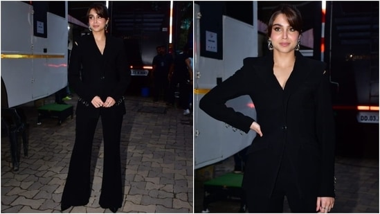 Sharvari Wagh aced the boss babe look during a shoot, dressed in a black blazer and high-waisted flared pants. The jacket has padded shoulders, full-length sleeves, front button closures, and a tailored fitting. She styled the ensemble with statement earrings, pumps, rings, minimal makeup, and hair tied in a ponytail. (Instagram)