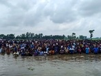 Bangladeshi nationals gathered at the international border at Sitalkuchi in Cooch Behar on Friday in an attempt to enter India.(HT_PRINT) Bangladeshi nationals gathered at the international border at Sitalkuchi in Cooch Behar on Friday in an attempt to enter India.(HT_PRINT)