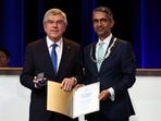 Paris 2024 Olympics - IOC Session - Main Press Centre, Paris, France - August 10, 2024. New IOC Athletes' Commission vice chair Abhinav Bindra and International Olympic Committee (IOC) President Thomas Bach during the IOC Session REUTERS/Piroschka Van De Wouw