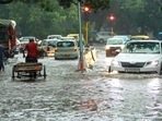 Vehicles pass through a waterlogged road in Jangpura in Delhi on Sunday. (HT Photo) Vehicles pass through a waterlogged road in Jangpura in Delhi on Sunday. (HT Photo)