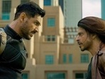 Shah Rukh Khan and John Abraham in Pathaan. Shah Rukh Khan and John Abraham in Pathaan.