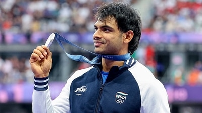 India's Javelin thrower Neeraj Chopra poses for a picture with his silver medal. (Sukumaran)