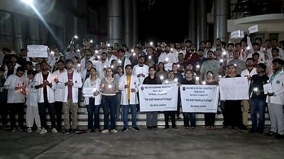 Doctors hold a candle march against the sexual assault and murder of a female postgraduate trainee doctor in Kolkata RG Kar Medical College. (ANI) Doctors hold a candle march against the sexual assault and murder of a female postgraduate trainee doctor in Kolkata RG Kar Medical College. (ANI)
