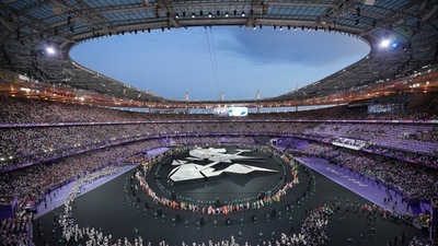 Flag bearers march during the 2024 Summer Olympics closing ceremony at the Stade de France (AP) Flag bearers march during the 2024 Summer Olympics closing ceremony at the Stade de France (AP)