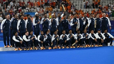 India's players pose on the podium with their bronze medals after the men's final field hockey match between Germany and the Netherlands during the Paris 2024 Olympic Games at the Yves-du-Manoir Stadium in Colombes on August 8, 2024. (Photo by Arun SANKAR / AFP) (AFP) India's players pose on the podium with their bronze medals after the men's final field hockey match between Germany and the Netherlands during the Paris 2024 Olympic Games at the Yves-du-Manoir Stadium in Colombes on August 8, 2024. (Photo by Arun SANKAR / AFP) (AFP)