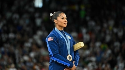After the review, the score for Chiles, who won team gold with the United States, was upgraded to 13.766. That was enough to earn bronze behind Brazil's Rebeca Andrade and Biles. (AFP) After the review, the score for Chiles, who won team gold with the United States, was upgraded to 13.766. That was enough to earn bronze behind Brazil's Rebeca Andrade and Biles. (AFP)