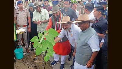 Haryana chief minister Nayab Singh Saini during the plantation drive organised by Sant Nirankari Seva Mission at Atta village in Panipat’s Samalkha on Sunday. (HT Photo)