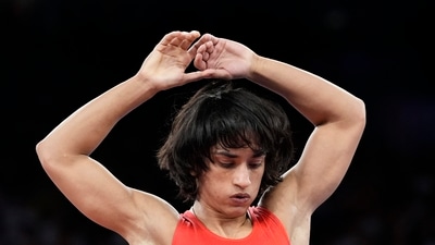 India's Vinesh Phogat during the women's freestyle 50kg quarterfinal wrestling match at the 2024 Summer Olympics, at Champ-de-Mars Arena, in Paris, France, Tuesday, Aug. 6, 2024, (PTI) India's Vinesh Phogat during the women's freestyle 50kg quarterfinal wrestling match at the 2024 Summer Olympics, at Champ-de-Mars Arena, in Paris, France, Tuesday, Aug. 6, 2024, (PTI)