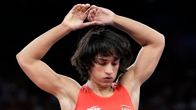 India's Vinesh Phogat during the women's freestyle 50kg quarterfinal wrestling match at the 2024 Summer Olympics, at Champ-de-Mars Arena, in Paris, France, Tuesday, Aug. 6, 2024, (PTI) India's Vinesh Phogat during the women's freestyle 50kg quarterfinal wrestling match at the 2024 Summer Olympics, at Champ-de-Mars Arena, in Paris, France, Tuesday, Aug. 6, 2024, (PTI)