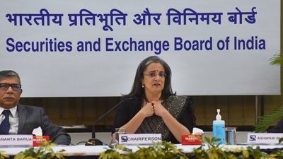 Sebi chairperson Madhabi Puri Buch with Whole Time Members (WTM) Ananta Barua (left) and Ashwani Bhatia during a press conference, at Sebi head office in Mumbai. (PTI) Sebi chairperson Madhabi Puri Buch with Whole Time Members (WTM) Ananta Barua (left) and Ashwani Bhatia during a press conference, at Sebi head office in Mumbai. (PTI)
