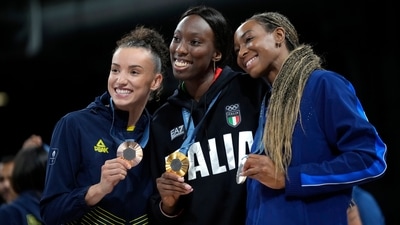 From left Gabriela Braga of Brazil, Paola Egonu of Italy and Chiaka Ogbogu of the United States, show their medals after ceremony at the end of the women's volleyball final at the 2024 Summer Olympics (AP) From left Gabriela Braga of Brazil, Paola Egonu of Italy and Chiaka Ogbogu of the United States, show their medals after ceremony at the end of the women's volleyball final at the 2024 Summer Olympics (AP)
