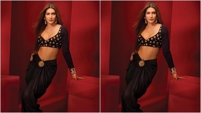 Kriti embraced her inner goddess in this sultry embroidered blouse and skirt look. The ensemble is from the House of Masaba. She styled it with statement gold earrings, bracelets, and striking makeup. (Instagram) Kriti embraced her inner goddess in this sultry embroidered blouse and skirt look. The ensemble is from the House of Masaba. She styled it with statement gold earrings, bracelets, and striking makeup. (Instagram)