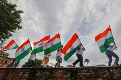 People celebrate the day with pomp and grandeur. (PTI) People celebrate the day with pomp and grandeur. (PTI)