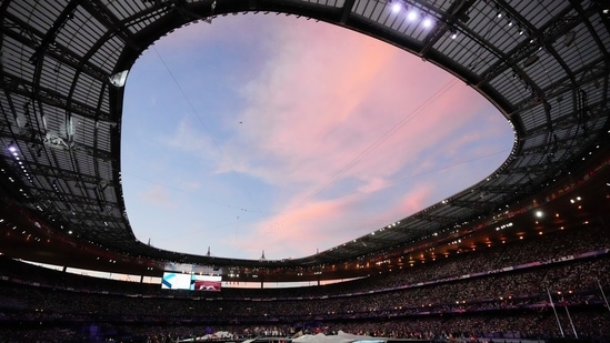 Athletes arrive at the Stade de France during the closing ceremony of the 2024 Summer Olympics(AP)