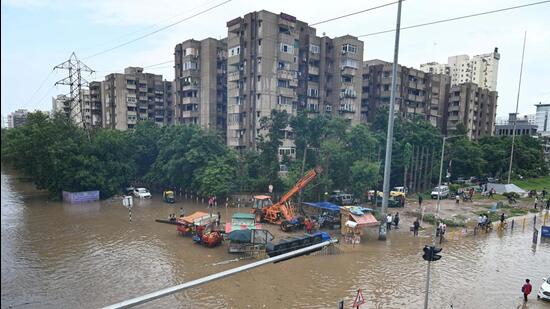 Heavy waterlogging at Subhash Chowk in Gurugram Sector 47 on Sunday. (Parveen Kumar/HT Photo)