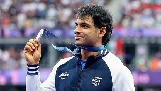 India's javelin thrower Neeraj Chopra poses for a picture with his silver medal at the Paris Olympics. (ANI)