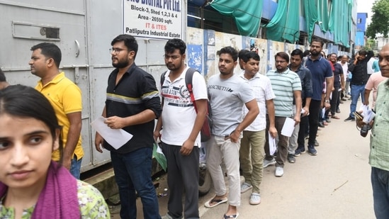 Candidates wait to enter the exam hall to appear for NEET PG 2024 exam in Patna.(Santosh Kumar)