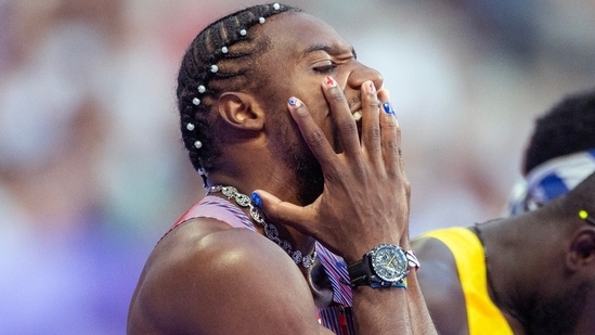 Noah Lyles caught attention with his painted nails and pearl-beaded hairdo