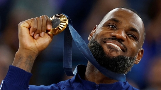 Paris 2024 Olympics - Basketball - Men's Victory Ceremony - Bercy Arena, Paris, France - August 10, 2024. Gold medallist Lebron James of United States poses with his medal.(REUTERS)