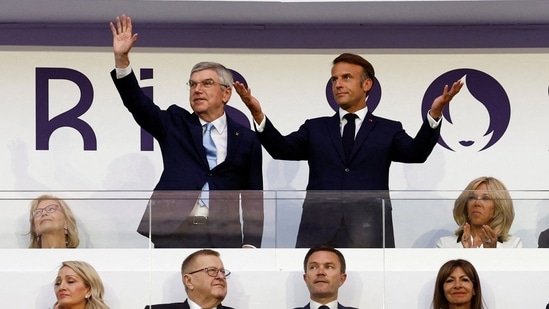 France President Emmanuel Macron and International Olympic Committee (IOC) President Thomas Bach are pictured before the closing ceremony(REUTERS)
