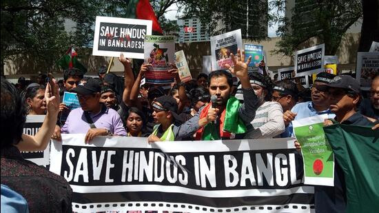 Participants at a protest against ongoing atrocities targeting minorities in Bangladesh, in Toronto, Canada on Saturday. (Supplied photo)