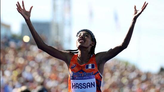 Sifan Hassan of Netherlands celebrates after winning gold. (REUTERS)