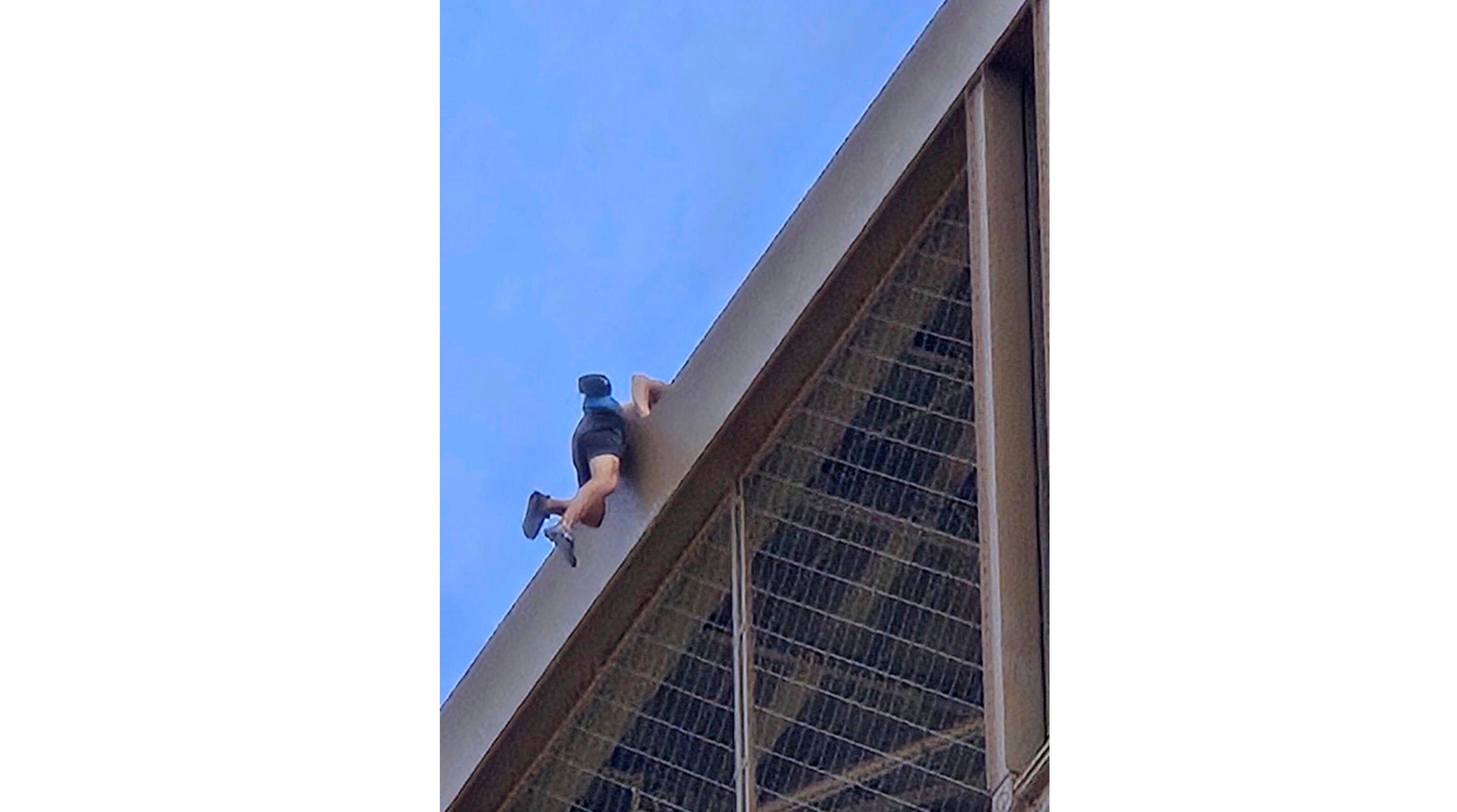 The shirtless man was seen scaling the 330-metre (1,083-foot) tall tower in the afternoon. (AP) The shirtless man was seen scaling the 330-metre (1,083-foot) tall tower in the afternoon. (AP)