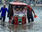 A vehicle moves through a waterlogged Sikar road following heavy monsoon rain in Jaipur on Monday. (PTI) A vehicle moves through a waterlogged Sikar road following heavy monsoon rain in Jaipur on Monday. (PTI)