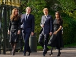 FILE - Britain's Prince William, second left, Kate, Princess of Wales, left, Britain's Prince Harry, second right, and Meghan, Duchess of Sussex view the floral tributes for the late Queen Elizabeth II outside Windsor Castle, in Windsor, England on Sept. 10, 2022. (AP Photo/Martin Meissner, File)(AP)