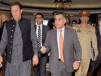 A file photo of ex-Pakistan ISI chief Faiz Hameed with Imran Khan