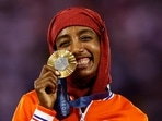 Gold medalist Sifan Hassan of Netherlands celebrates on the podium.