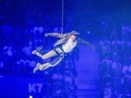 Tom Cruise is lowered on the Stade de France during the 2024 Summer Olympics closing ceremony, Sunday, Aug. 11, 2024, in Saint-Denis, France. (AP Photo/Natacha Pisarenko)(AP)