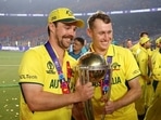 Travis Head (L) and Marcus Labuschagne with the World Cup trophy