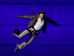 Tom Cruise leaps from the top of the stadium at Paris Olympics