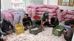 Workers packing garlic into carts to be sold in the market, in Kullu. (ANI) Workers packing garlic into carts to be sold in the market, in Kullu. (ANI)