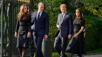FILE - Britain's Prince William, second left, Kate, Princess of Wales, left, Britain's Prince Harry, second right, and Meghan, Duchess of Sussex view the floral tributes for the late Queen Elizabeth II outside Windsor Castle, in Windsor, England on Sept. 10, 2022. (AP Photo/Martin Meissner, File) (AP) FILE - Britain's Prince William, second left, Kate, Princess of Wales, left, Britain's Prince Harry, second right, and Meghan, Duchess of Sussex view the floral tributes for the late Queen Elizabeth II outside Windsor Castle, in Windsor, England on Sept. 10, 2022. (AP Photo/Martin Meissner, File) (AP)